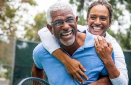 Photo of two older adults laughing