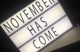 November Has Come on a lit marquee