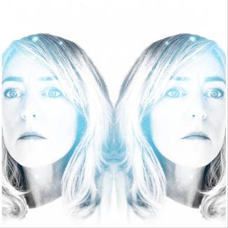 Mirrored image of white woman with blonde hair